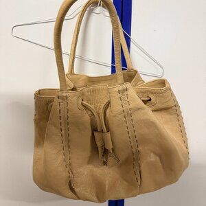 Tan women's purse by Carlos Falchi